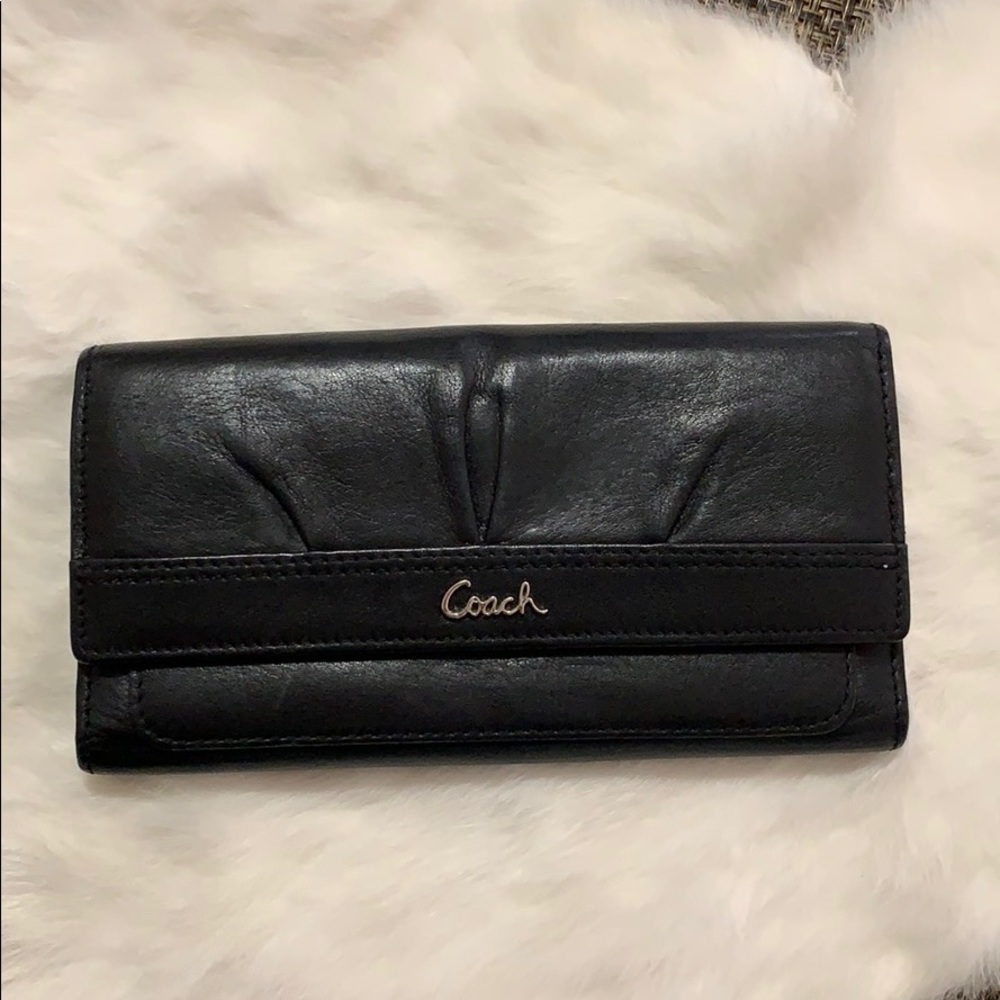 Like NWOT Authentic Coach black leather wallet.